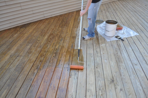 applying-a-deck-sealer-using-a-roller